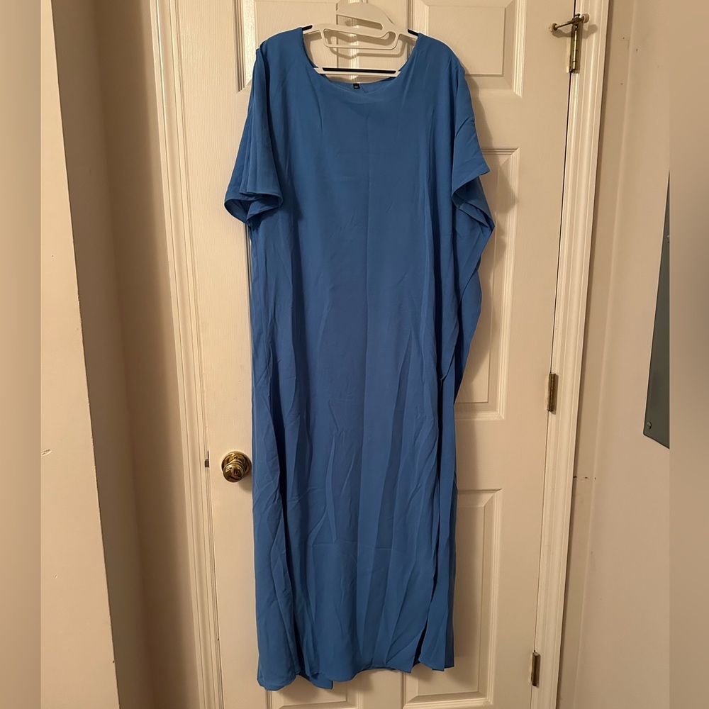 Blue women’s dress suit with pants. Size 4xl. Never worn.